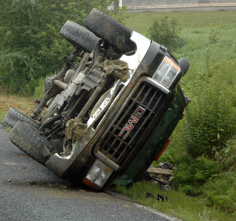 A GMC pickup rests on its side after a rollover in Bremen the morning of Tuesday, July 18. (Alexander Violo photo)