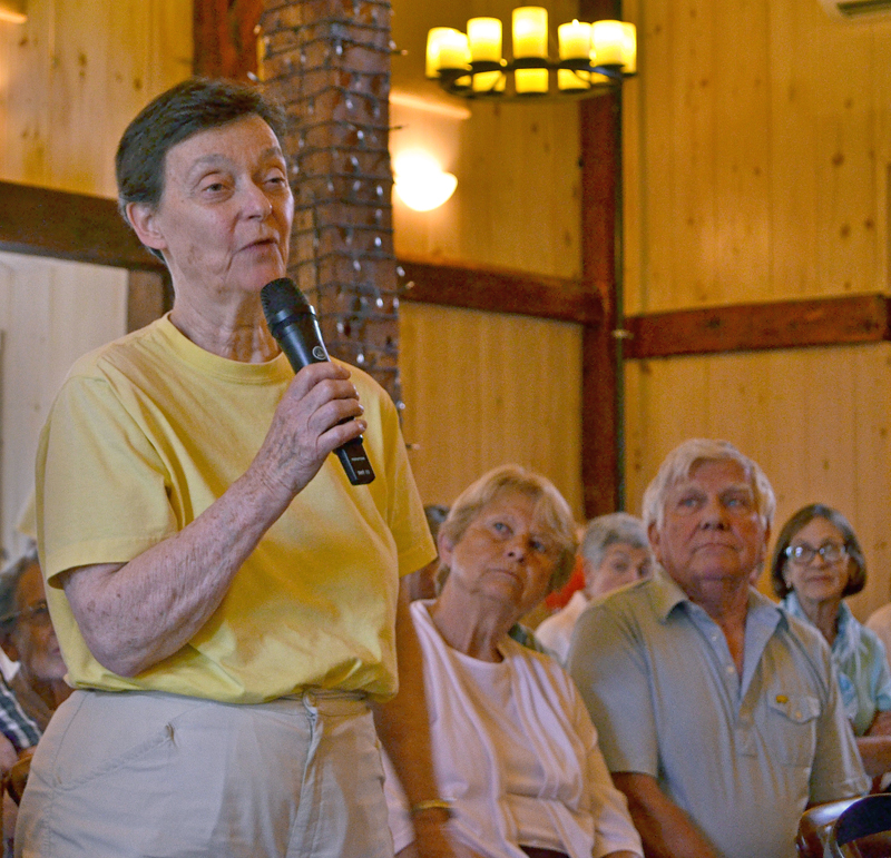 Meradith Hill talks about the care she and her husband, Bill Hill, have received at LincolnHealth's Miles Campus in Damariscotta during a public forum about the MaineHealth unification proposal Wednesday, July 12. (Maia Zewert photo)