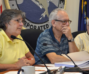 From left: Damariscotta Board of Selectmen Chair Robin Mayer speaks during a public hearing about recreational marijuana at the town office Wednesday, July 19 as Selectmen Ronn Orenstein and George Parker look on. (Maia Zewert photo)