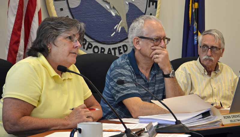 From left: Damariscotta Board of Selectmen Chair Robin Mayer speaks during a public hearing about recreational marijuana at the town office Wednesday, July 19 as Selectmen Ronn Orenstein and George Parker look on. (Maia Zewert photo)