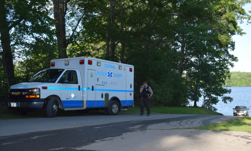 An ambulance waits at the public boat ramp on Damariscotta Lake in Jefferson on Sunday, July 9. The Maine Warden Service is investigating a fatality on the lake.