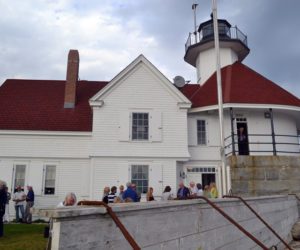 Guests at a fundraiser at Cuckolds Lighthouse on Wednesday, July 10 enjoy a rare glimpse of the results of a decade-long reconstruction and preservation effort. (Abigail Adams photo)