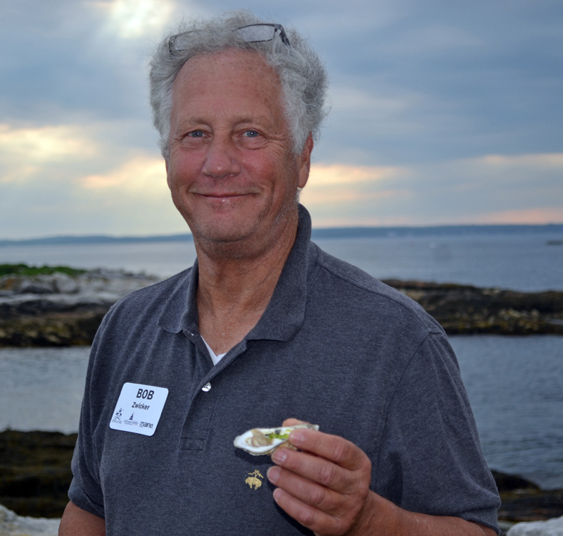 Bob Zwicker enjoys a Glidden Point oyster during "An Evening at the Cuckolds Lighthouse" on Wednesday, July 12. (Abigail Adams photo)