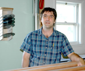 Medomak Woodworking LLC owner Jesse Collins, of Bremen, is the first tenant of the BugTussle Brooder on Depot Street in Waldoboro. (Alexander Violo photo)