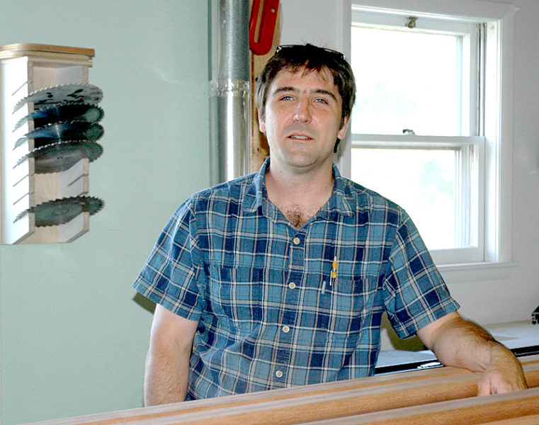 Medomak Woodworking LLC owner Jesse Collins, of Bremen, is the first tenant of the BugTussle Brooder on Depot Street in Waldoboro. (Alexander Violo photo)