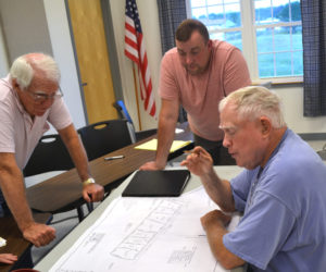From left: Whitefield Planning Board members Steve Sheehy and Jake Mathews look on as Steve Smith discusses his plans for his Route 17 property during the board's Wednesday, July 19 meeting. (Abigail Adams photo)
