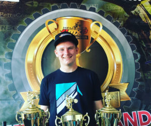 Zach Farrin with the three first-place gold cups he won at the 11th annual Gold Cup New England Classic motocross event. (Photo courtesy Gary Farrin)