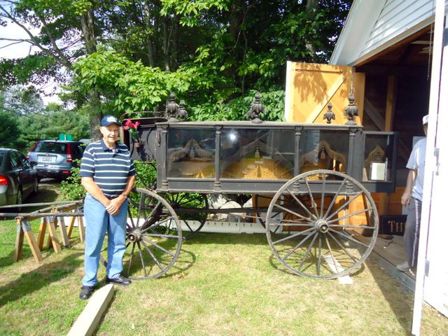 Ralph Bond stands beside his grandfather's 1800s horse-drawn hearse, which will be on display at the Saturday, Aug. 5 open house and exhibit day at the Old Jefferson Town House.