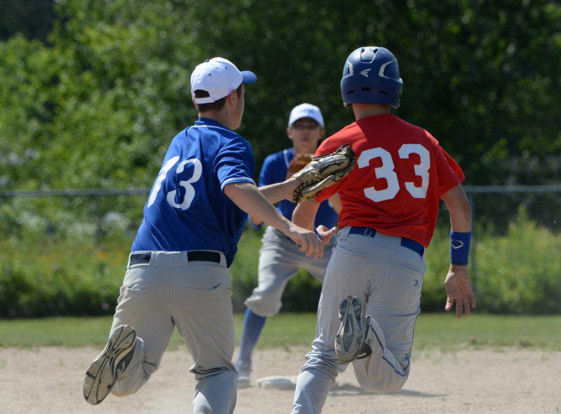 Luke Hamlin tags out Ty Knowlton after catching him in a pickle. (Paula Roberts photo)