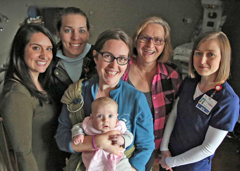 From left: LincolnHealth -- Miles Campus certified lactation counselors Danielle Peart, Kim Macomber, Elizabeth Cole, Glenda Beverage, and Jessica Taylor are pictured with baby Maida.