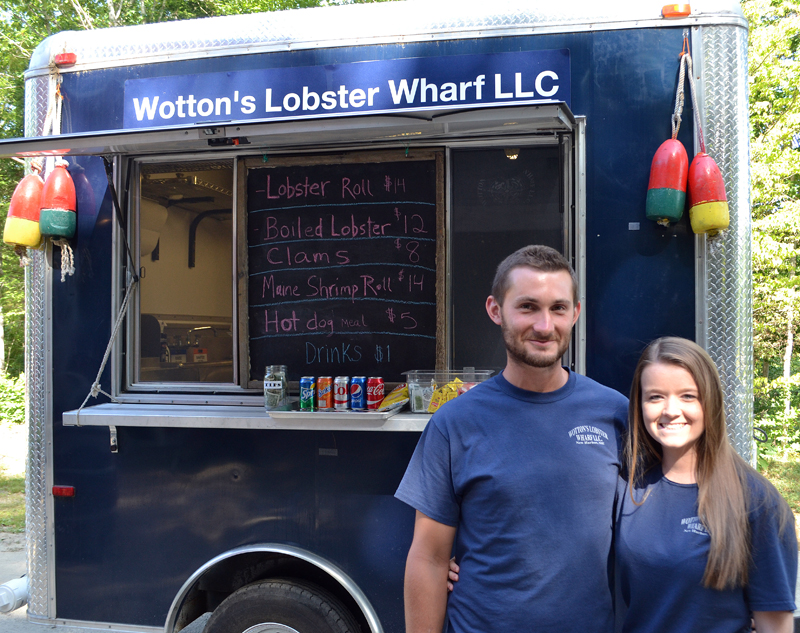 Merritt Wotton and Shannon Barter stand in front of the Wotton's Lobster Wharf LLC mobile kitchen. (Maia Zewert photo)
