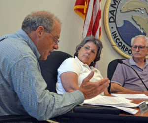 Damariscotta Town Manager Matt Lutkus (left) speaks during the Damariscotta Board of Selectmen's meeting Tuesday, Aug. 1 while Selectmen Robin Mayer and Ronn Orenstein look on. (Maia Zewert photo)