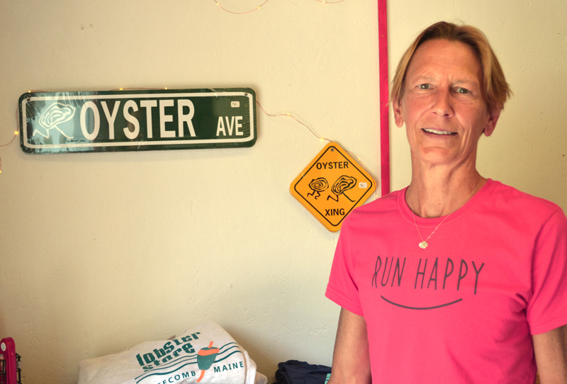 Barb Scully stands with some of the unique products available at Scully's Oyster and Lobster Market on River Road in Edgecomb on Thursday, Aug. 17. (Abigail Adams photo)