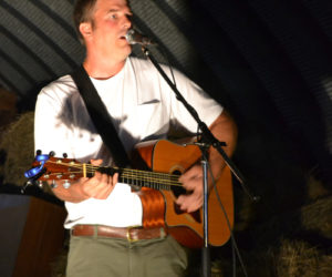 Pittston singer-songwriter Walter Weymouth entertains the crowd gathered in the barn at Sheepscot General the evening of Friday, Aug. 18. (Christine LaPado-Breglia photo)