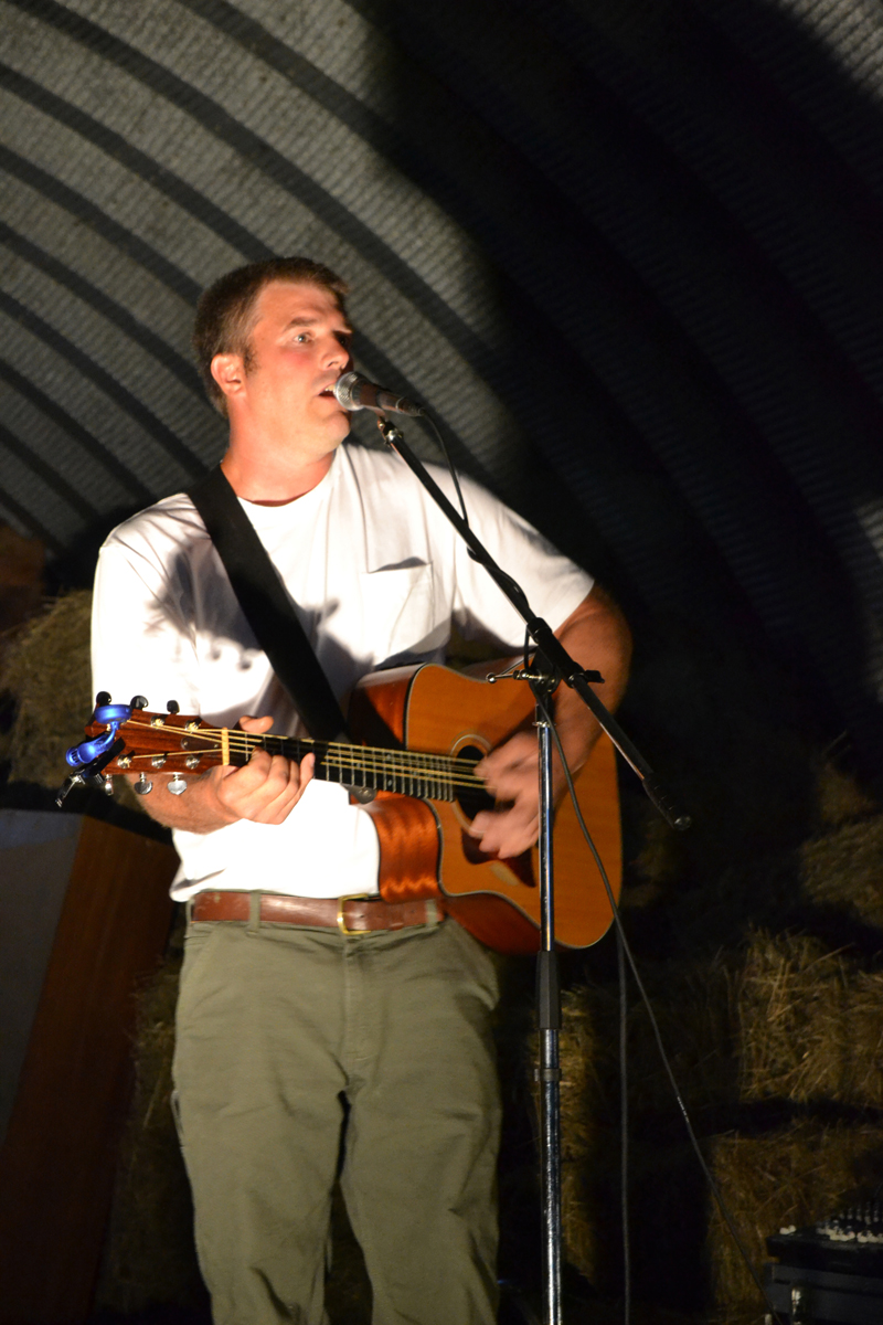 Pittston singer-songwriter Walter Weymouth entertains the crowd gathered in the barn at Sheepscot General the evening of Friday, Aug. 18. (Christine LaPado-Breglia photo)
