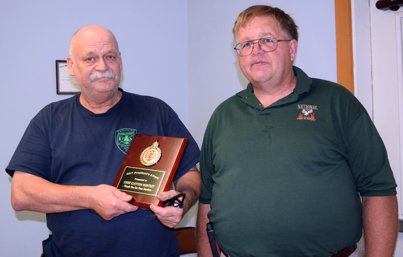 Newcastle Fire Chief Clayton Huntley (left) received the President's Award from Lincoln County Fire Chiefs Association President Wally Morris. (J.W. Oliver photo)