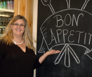 Judy Heaton shows off changes to the interior of McGreevy's Corner Store in Waldoboro. The store opened Monday, Aug. 21. (Alexander Violo photo)