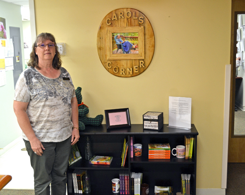 Julie Bailey stands in Carol's Corner on Tuesday, Aug. 15. Carol's Corner offers free books to the Sheepscot Valley Health Center's young patients. (Abigail Adams photo)