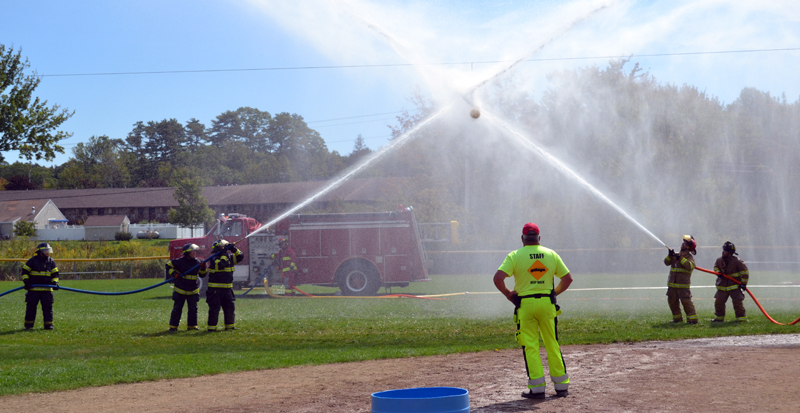 The Newcastle Fire Department battles York Beach in the waterball competition during the muster at the 54th Maine State Federation of Firefighters Convention in Boothbay Harbor. (Abigail Adams photo)