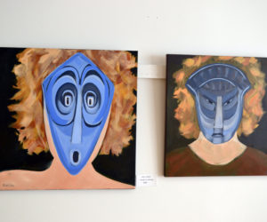 Two of the six paintings in Sarah Wilde's masks series in the West Gallery of River Arts. (Christine LaPado-Breglia photo)