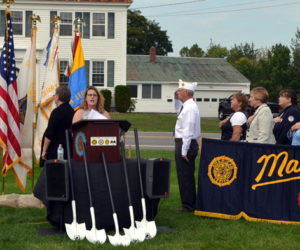 Boothbay Region High School senior Jackie McLoon, of Boothbay Harbor, sings the national anthem during the groundbreaking for a new POW/MIA memorial at The American Legion's state headquarters in Winslow on Friday, Sept. 15. (Charlotte Boynton photo)