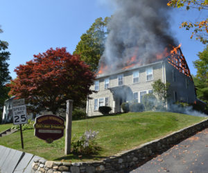 Flames and heavy smoke pour out of the roof of a building at 50 Main St. in Newcastle on Tuesday, Sept. 12. (Maia Zewert photo)