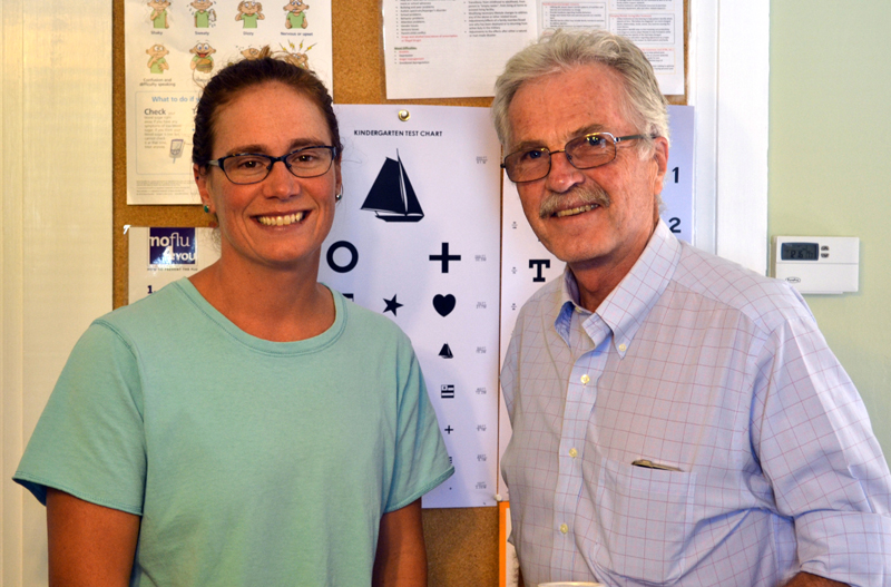 Wiscasset Family Medicine's new owner, Dr. Cortney Linville, stands wiith practice founder Dr. Edward Kitfield in their office on Water Street in Wiscasset on Wednesday, Sept. 13. (Abigail Adams photo)