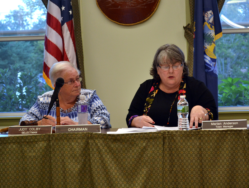 Wiscasset Town Manager Marian Anderson (right) reads a citizen's petition to transfer planning funds to surplus Tuesday, Sept. 12 as Wiscasset Board of Selectmen Chair Judy Colby looks on. (Abigail Adams photo)