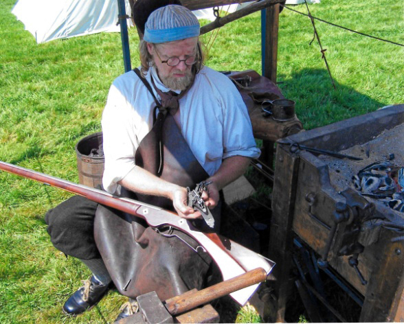 Jeffrey Miller works on a wheellock musket at Colonial Pemaquid State Historic Site.