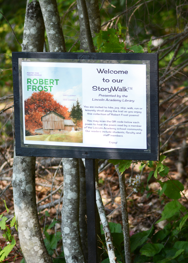 This sign welcomes walkers to Lincoln Academy's new Robert Frost StoryWalk, a project created by the LA library.