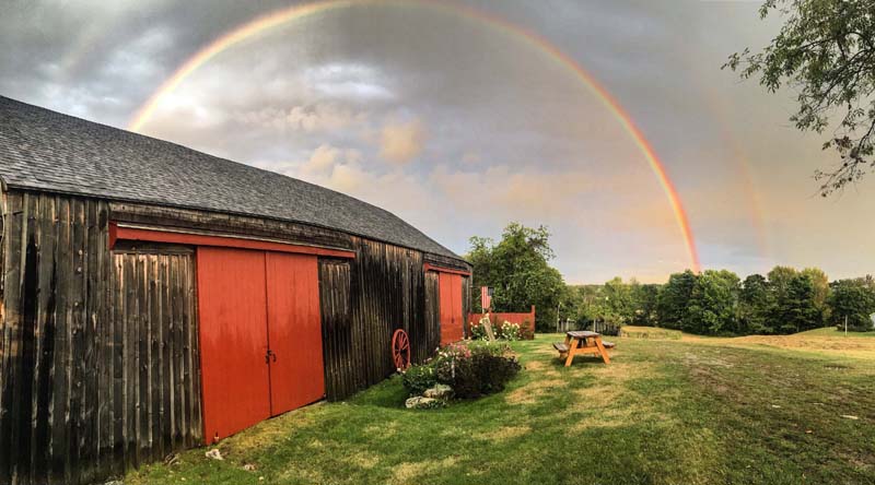 Kristin Orne's photo of a double rainbow over a barn in Bristol received the most votes to become the ninth monthly winner of the #LCNme365 photo contest. Orne will receive a $50 gift certificate from Renys, the sponsor of the September contest.