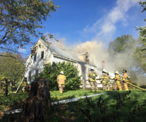 Firefighters work to extinguish a structure fire on Redonnet Mill Road in Bristol Mills. (Maia Zewert photo)