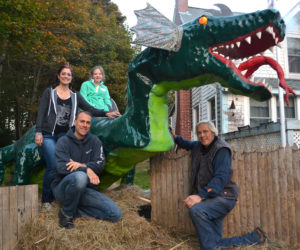 From left: April Morrison, Leon Vanella, Sophie Yates-Paul, and Michael Morrison pose next to Colby the dragon at the Haunted Castle's Keep in New Harbor on Sunday, Oct. 22. (Maia Zewert photo)