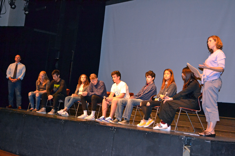 Lincoln Academy Director of Resident Life Ken Stevenson (left) and Kelley Duffy, a Lincoln Academy social studies teacher, flank the eight LA students participating in a Q&A session after the screening of "Maineland" on Oct. 4 at Lincoln Theater. (Christine LaPado-Breglia photo)