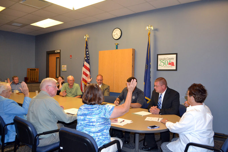 The Lincoln and Sagadahoc Multicounty Jail Authority Board of Directors votes to appoint James Bailey (second from right) administrator of Two Bridges Regional Jail during a special meeting Wednesday, Sept. 27. (Charlotte Boynton photo)