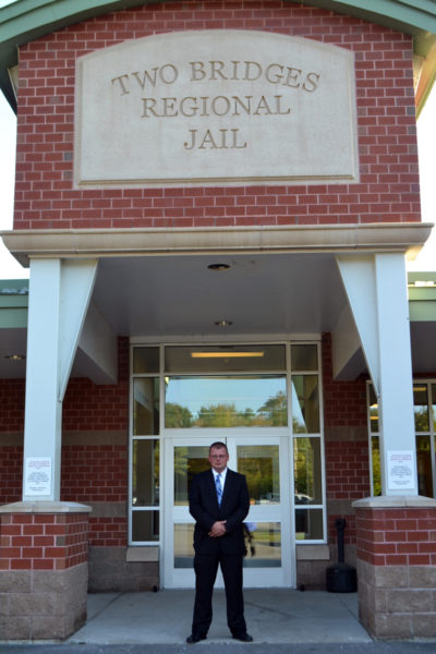 Two Bridges Regional Jail Administrator James Bailey stands at the front entrance to the jail shortly after his appointment as administrator Wednesday, Sept. 27. (Charlotte Boynton photo)
