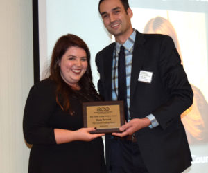 J.W. Oliver, editor of The Lincoln County News, presents the 2017 Bob Drake Young Writer's Award to LCN reporter Maia Zewert.