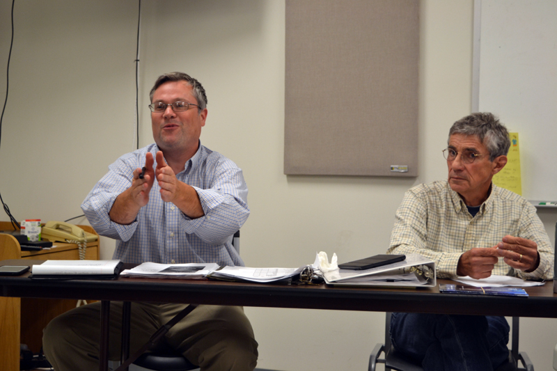 Aaron Miller (left), administrative assistant to the Whitefield Board of Selectmen, discusses possible new ways to alert the public to horse-and-buggy traffic in the area as Selectman Tony Marple looks on. (Christine LaPado-Breglia photo)