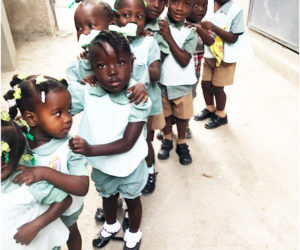 Children at Jesi-Mari Catholic School, where a school lunch program is proposed.