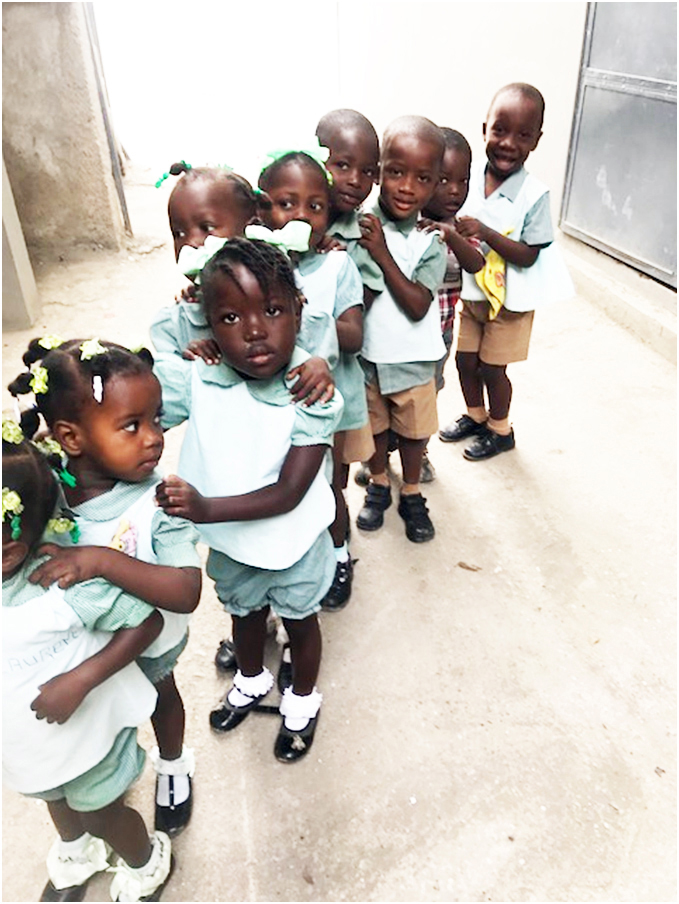 Children at Jesi-Mari Catholic School, where a school lunch program is proposed.