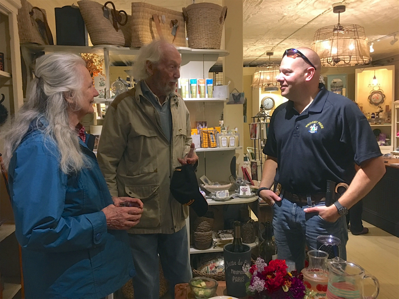 Wiscasset Police Chief Jeffrey Lange (right) talks with local residents Marie and John Reinhardt during his Chief Chat at SeptemberÂ’s Wiscasset Art Walk. According to Lange, community events give people an opportunity to have direct access to him, which he sees as a critical part of effective community policing.