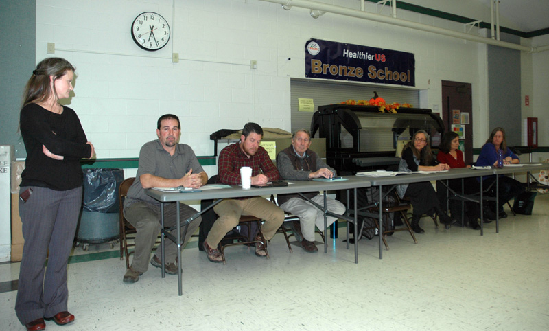 The AOS 93 Board opens its forum about Lincoln Academy at Great Salt Bay Community School in Damariscotta on Wednesday, Nov. 15. From left: Christa Thorpe, Joshua Hatch, Forrest Bryant, David Kolodin, Angela Russ, Stephanie Nelson, and Sara Mitchell. (Alexander Violo photo)