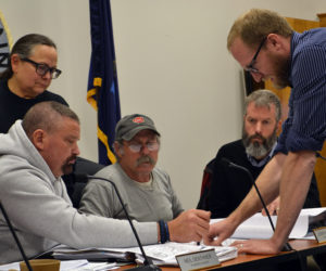 From left: Damariscotta Planning Board members Shari Sage, Neil Genthner, Jonathan Eaton, and Adam Maltese look on as engineer Shawn Tobey explains part of the plan for the 435 Main St. development Monday, Nov. 13. (Maia Zewert photo)