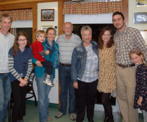 Moody's Diner co-owner Steve Moody (center) poses with family members during his retirement party at the diner Monday, Oct. 30. From left: Will Truesdell, Julia Truesdell, Myles Truesdell, Lisa Truesdell, Stephen Moody, Candace Moody, Linsey Moody, Travis Thiboutout, and Hannah Thiboutot. (Alexander Violo photo)