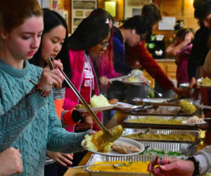 Lincoln Academy residential students enjoy a Thanksgiving feast at Camp Kieve on Wednesday, Nov. 22.