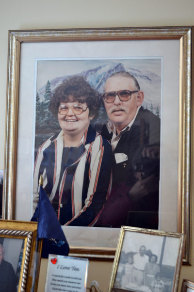 A 1987 photograph of Marilyn and Elden Beane sits alongside other memorabilia in their Crawford Commons room. (Christine LaPado-Breglia photo)