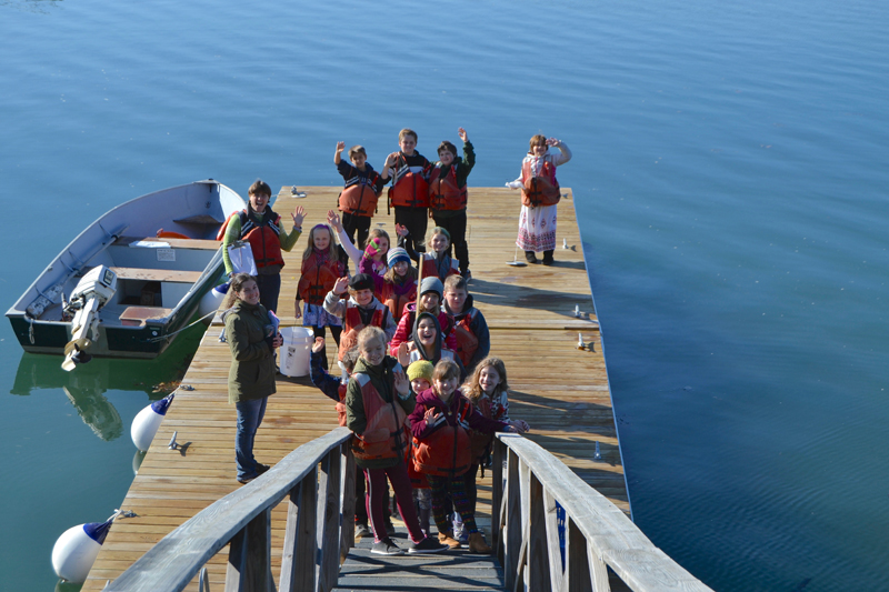 Elizabeth Lombardo and her South Bristol School students study marine science with outgoing Darling Marine Center K-12 Education Coordinator Lili Pugh on the centerÂ’s float.