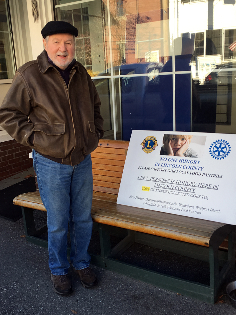 Rotarian Bob Topper solicits funds to help combat food insecurity.