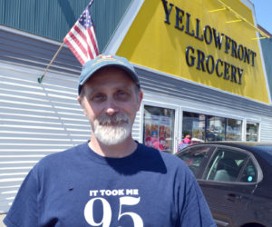 Yellowfront Grocery owner Jeff Pierce stands in front of the store at the time of its 95th anniversary celebration in June 2016. (Maia Zewert photo, LCN file)