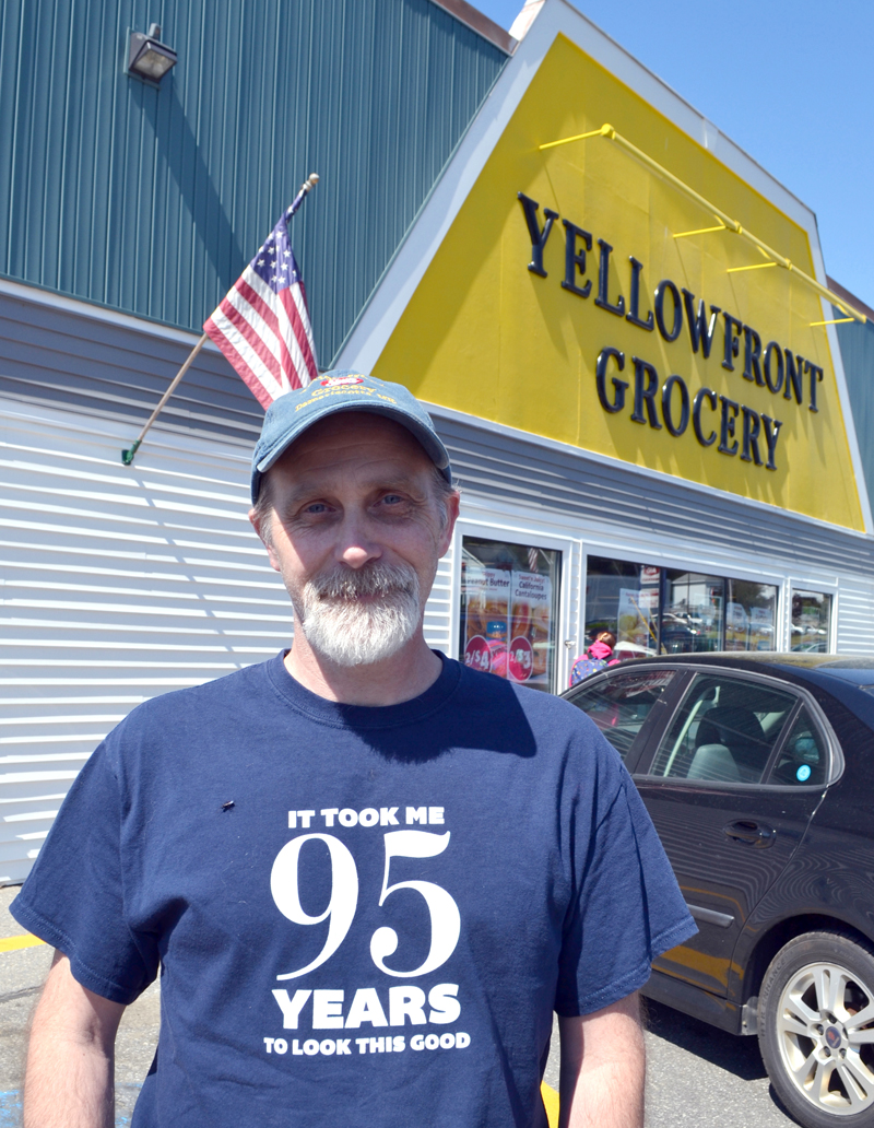 Yellowfront Grocery owner Jeff Pierce stands in front of the store at the time of its 95th anniversary celebration in June 2016. (Maia Zewert photo, LCN file)